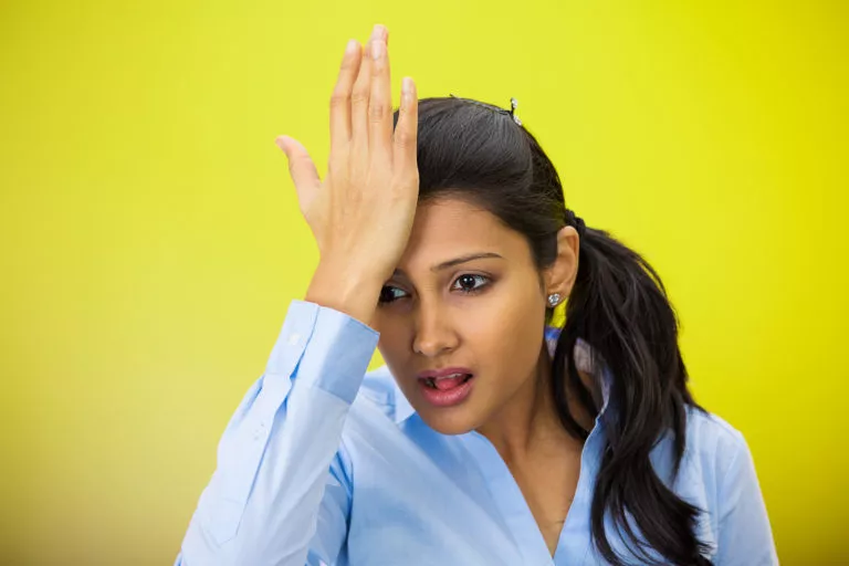 woman palming her forehead